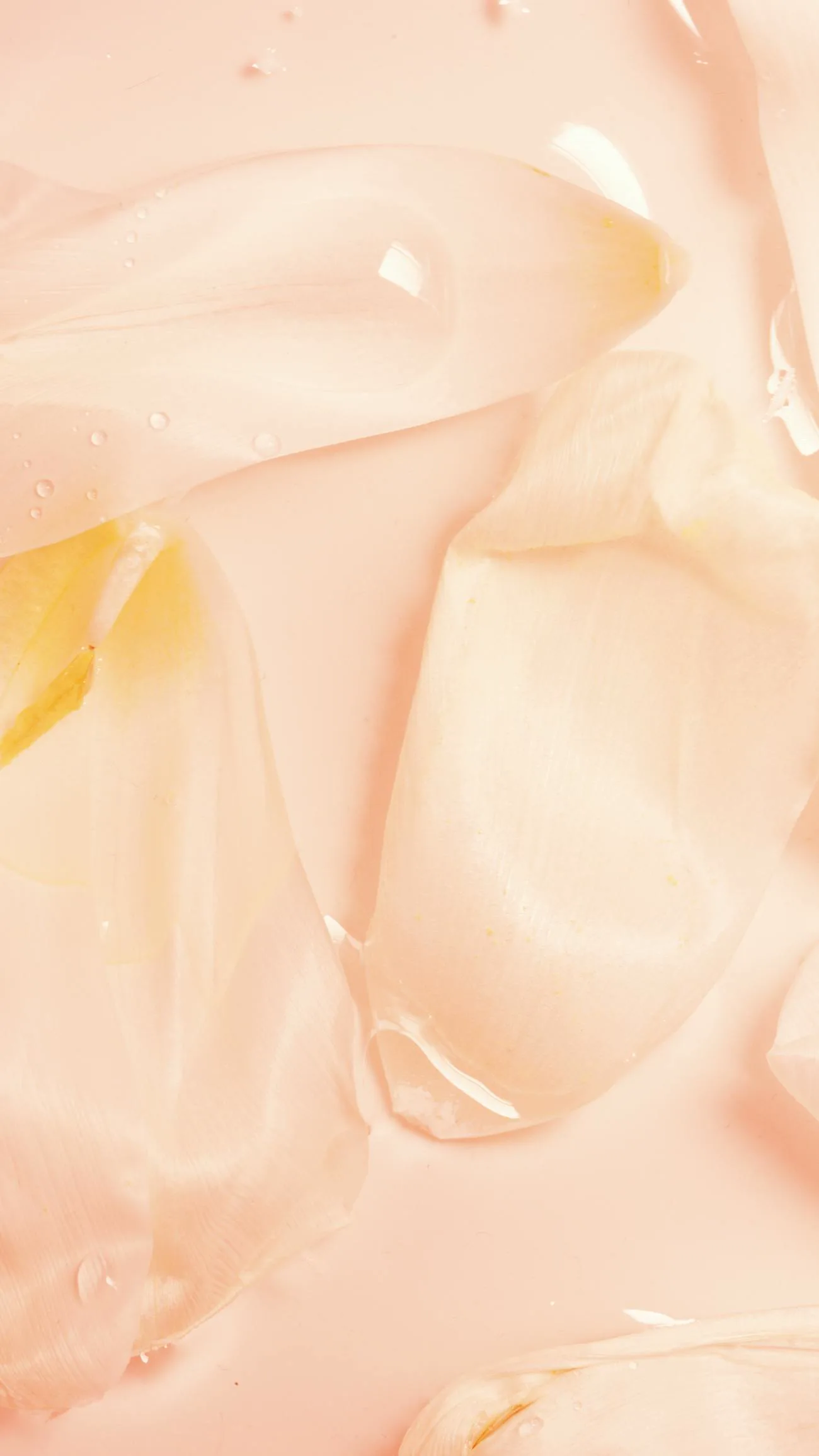 Glossy peachy-pink jelly facial mask texture