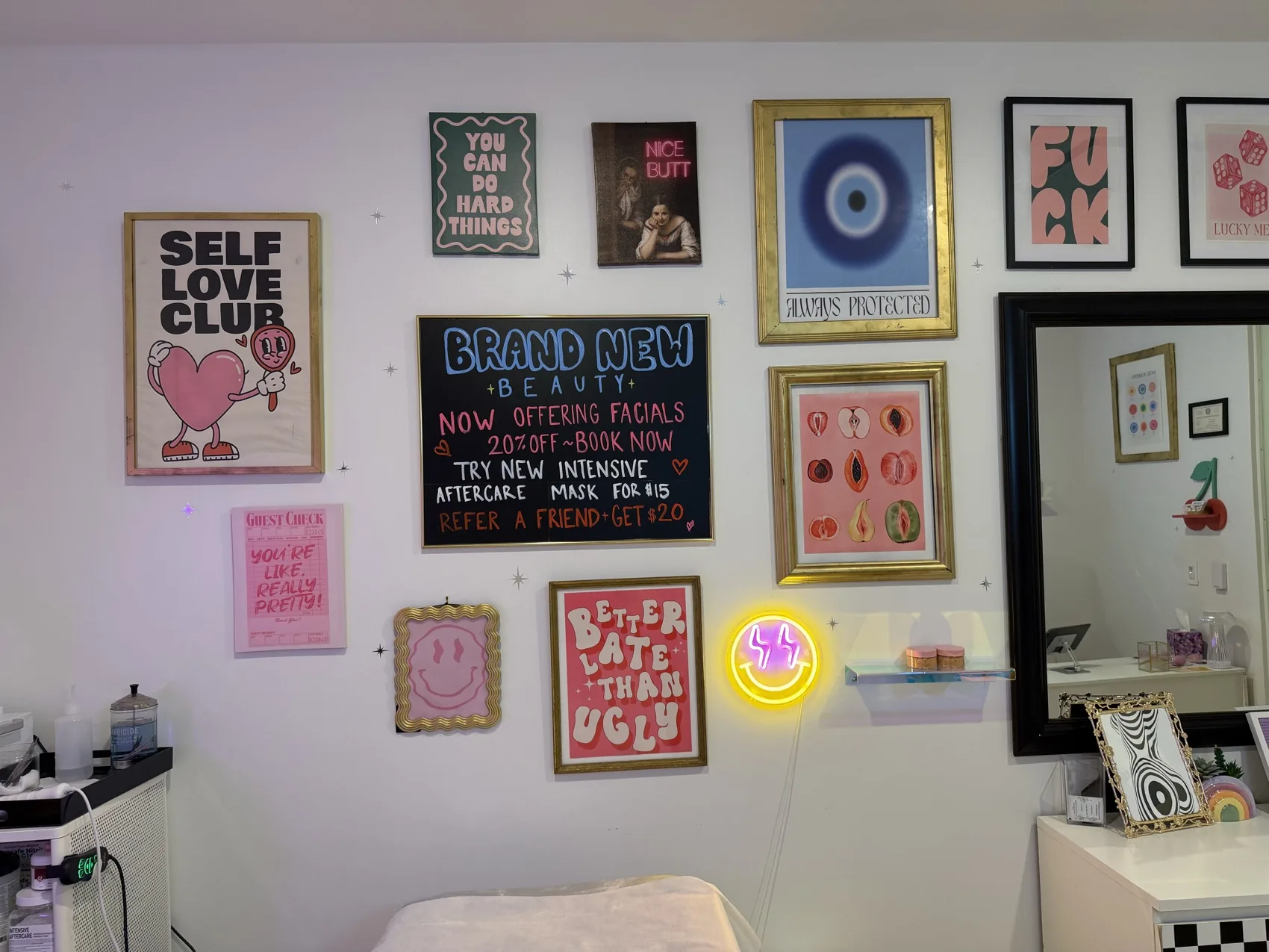 Bright art wall and mirror inside the private waxing suite